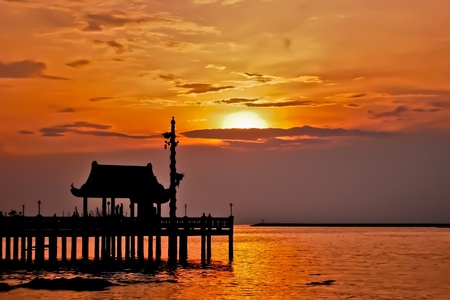 beautiful sunset with the shrine silhouetteの写真素材