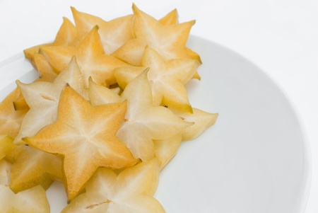 Sliced fresh star fruit on white background の写真素材
