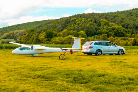 A glider attached to a car being dragged.の写真素材