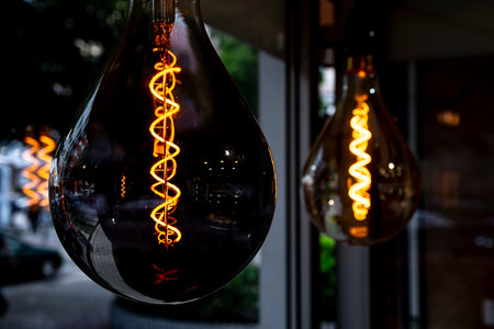 Decorative vintage lamp bulbs at twilight time. Beautiful vintage luxury light bulb hanging decor...