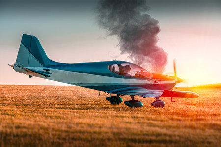 Plane emergency landing. Airplane with smoke from the engine.の写真素材