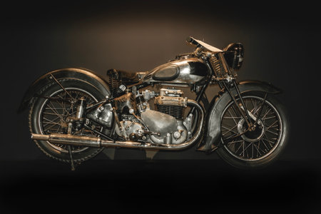 Vintage retro motorcycle rebuild on black background. Old morocycle with scratches of rust