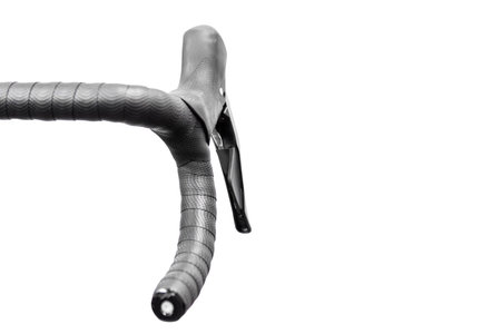 Black road bike handlebar isolated on white background. Bicycle handlebar with place for textの写真素材