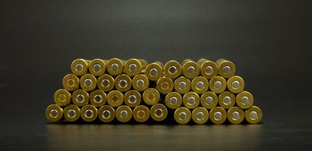Cartridges for a rifle lie on a black background. Brass sleeve with capsule.の写真素材