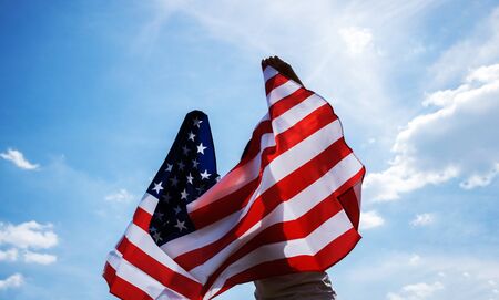 Young girl hold flag of USA, independence day, 4th of july concept