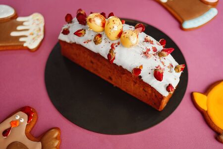 Amazing Chocolate Easter Cake with chocolate eggs on an background pink. Slice of cake. Easter concept, holiday cookiesの写真素材
