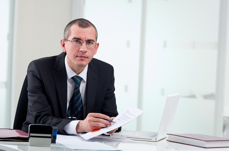 Lawyer or notary public on his workplace signing contractの写真素材