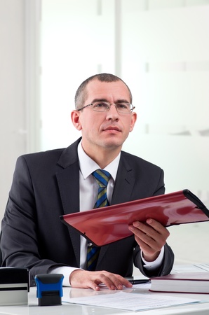 Lawyer or notary public on his workplace with file folderの写真素材