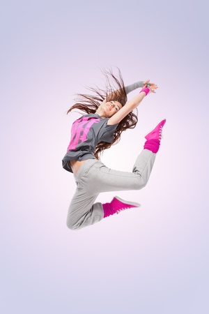 Hip-hop dancer girl posing making acrobatic moviesの写真素材