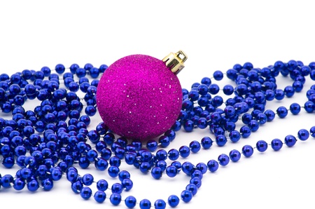 gold  christmas beads with bauble isolated on whiteの写真素材