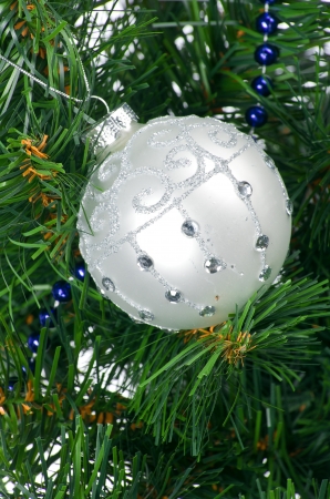 Close up image of christmas firtree with baublesの写真素材
