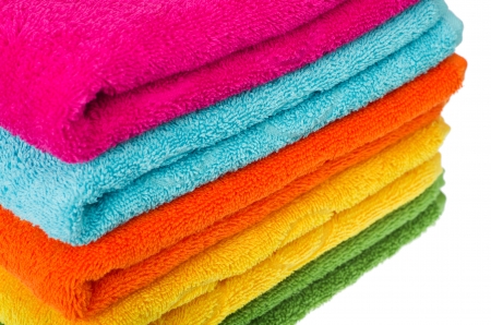 stacked colorful towels on a white backgrounの写真素材