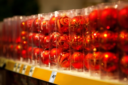 Line of xmas baubles on shelfs in hypermarketの写真素材