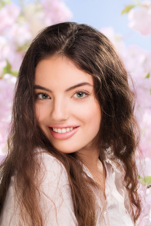 Portrait of happy smiling beautiful young woman, outdoorsの写真素材