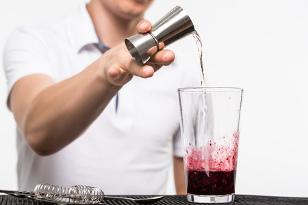 bartender preparing coctail with bar equipment, studio shoot