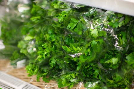 Supermarket shelf, Fresh organic herbs, parsley, dill. Fresh organic on shelf in supermarket. Healthy food concept. Vitamins.の写真素材