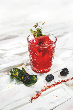 garnished cocktail on white backgroundの写真素材