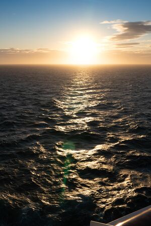 Beautiful sunrise over the sea, orange color filtered effectの写真素材