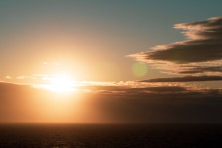 Beautiful sunrise over the sea, orange color filtered effect