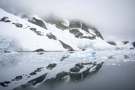 Melting glacier ice at Antarctic peninsula, lake caused by global warming. Beautiful landscape and scenery, Antarcticaの写真素材