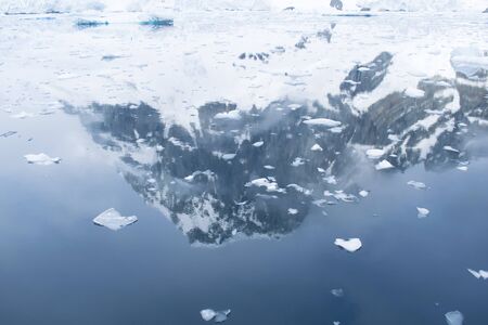 Icebergs floating. Ices and icebergs. Glacier lagoon. Melting ice. Glacier lagoon. Volcanic ash on...