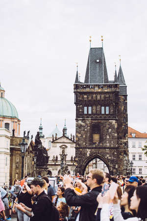 Prague, Czech Republic - August 17, 2019: Typical tourists taking pictures of the city in summerのeditorial素材