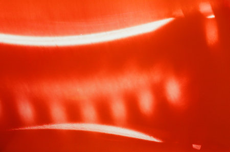 Twisted negative film. Abstract red background with lighting effect. Shallow depth of field.の写真素材