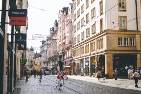 Brno, Czech Republic - August, 26: Beautiful architecture of the city on a sunny summer morning. Pedestrians crossing the streetのeditorial素材