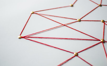 Linking entities. Network, networking, social media, connectivity, internet communication abstract. Web of red thread on white background.の写真素材