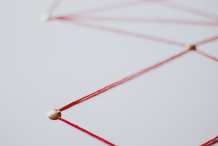Linking entities. Network, networking, social media, connectivity, internet communication abstract. Web of red thread on white background.の写真素材