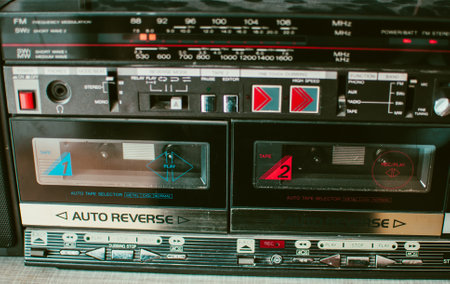Retro dusty boombox (tape recorder) on a shelf in a garageの写真素材