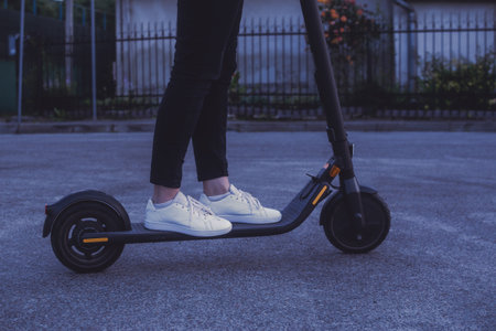 Girl riding an electric scooterの写真素材