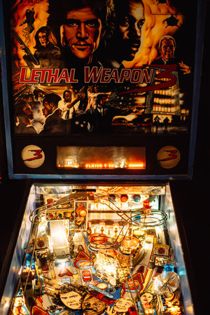 Krakow, Poland - November 17, 2023: A close-up of a pintball machine dedicated to a movie Lethal...