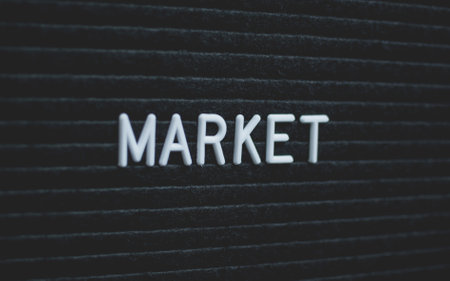 Word market written on the letter board. White letters on the black background. Business conceptの写真素材