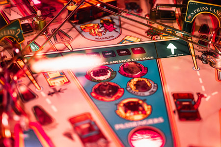 Krakow, Poland - November 17, 2023: Taxy, a retro pinball machine in a local bar. Close-up