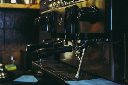 Classic coffee machine in a cafe. Cups and syrup bottles on the shelves.の写真素材