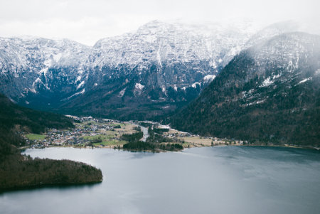 Breathtaking landscape view from the Hallstatt skywalk. Mountain dark blue lake and peaks covered with snow. Alps in Austria.の写真素材