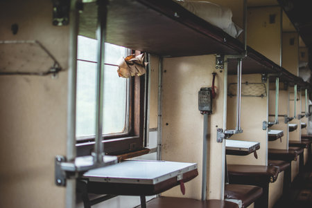 Pass in old abandoned soviet train car. Places for passangers