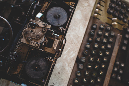 Dusty old-fashioned calculating machine in the storage. Top viewの写真素材