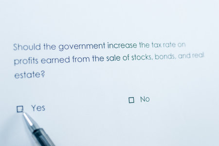 Should the government increase the tax rate on profits earned from the sale of stocks, bonds, and real estate? yesの写真素材