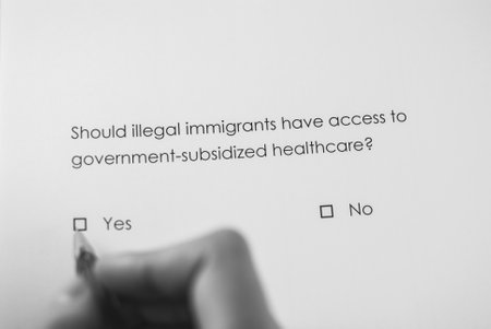 Poll question: Should illegal immigrants have access to government-subsidized healthcare? Answer: Yesの写真素材