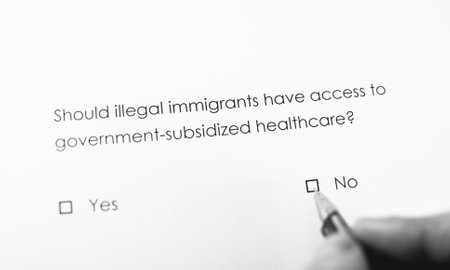 Poll question: Should illegal immigrants have access to government-subsidized healthcare? Answer: Noの写真素材