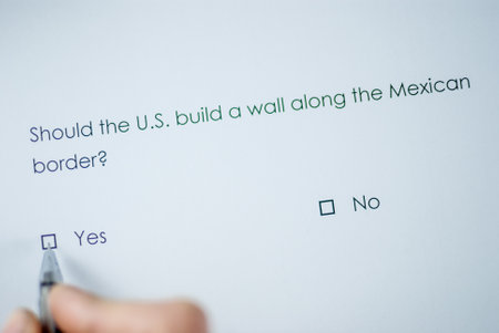 Poll question: Should the US build a wall along the Mexican border? Answer: yesの写真素材