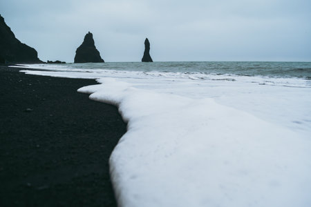 Soft white foam of oceanic water in Icelandの写真素材