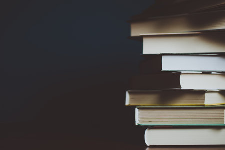 Tower of colorful books on the table. Closeup of pages. Abstract concept of knowledge, education, learning, and literature. Filterの写真素材