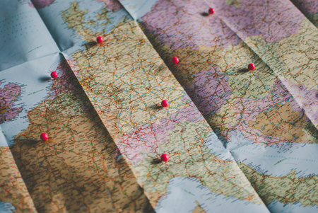 Closeup of a traveler's road map in vintage retro colors. Countries and cities of Western Europe on the map.の写真素材