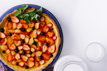 Pie strawberries, blueberries and blackberries. Picture for the menu or confectionery catalog. Milkの写真素材