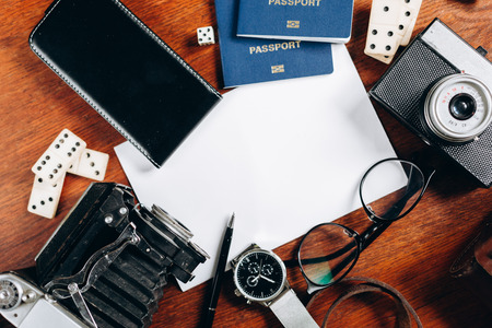 Overhead view of Traveler's accessories, Essential vacation items, Travel concept background. Different objects on wooden background.の写真素材