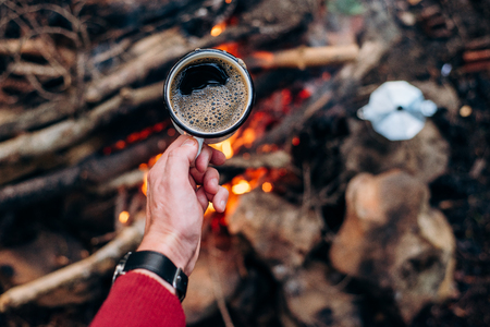 Cooking breakfast at a camp.の写真素材