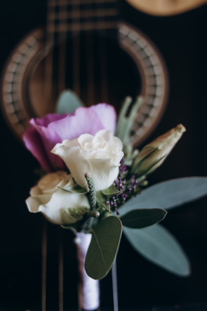 Wedding details. Flowers stand on guitar stringsの写真素材